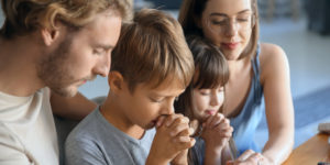 web3-family-pray-together-home-father-mother-child-shutterstock_1310080675